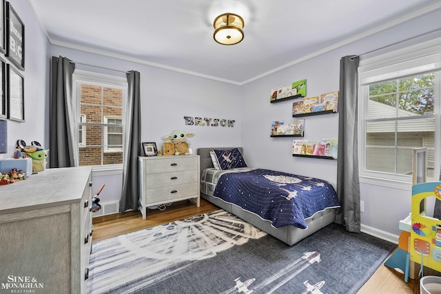1873 Manchester Blvd, Grosse Pointe Woods, MI 48236 - bedroom featuring wood finished floors, ornamental molding, and baseboards