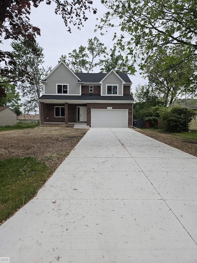 5573 Branch St, Sterling Heights, MI 48310 - view of front facade featuring brick siding, an attached garage, and driveway