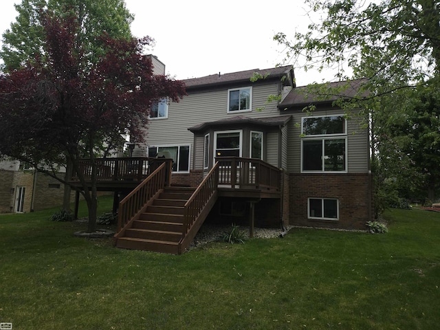 4324 Clear Creek Ct, Oakland Twp, MI 48306 - back of property with stairway, a deck, a yard, and brick siding