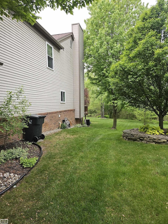 4324 Clear Creek Ct, Oakland Twp, MI 48306 - view of grassy yard with central air condition unit