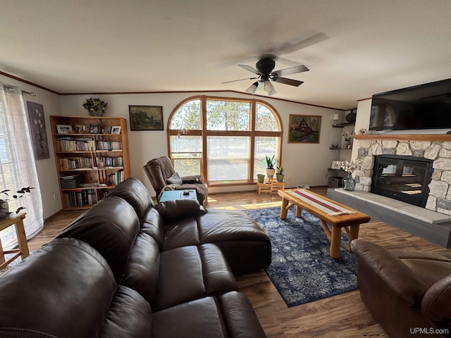 93 E Johnson Lake Rd, Gwinn, MI 49841 - living room with a ceiling fan, a fireplace, crown molding, and wood finished floors