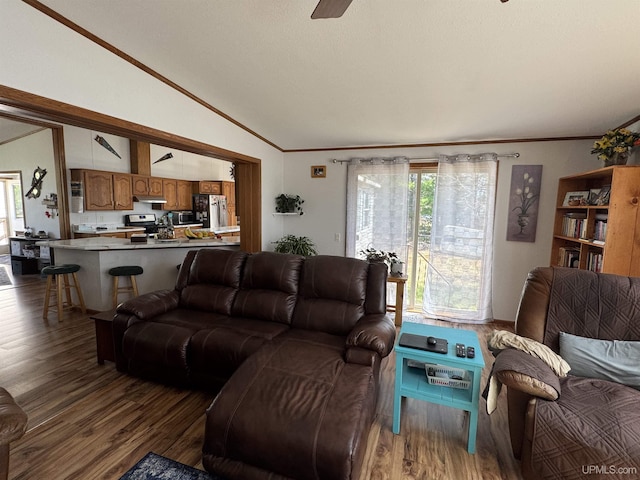 93 E Johnson Lake Rd, Gwinn, MI 49841 - living room with ornamental molding, vaulted ceiling, wood finished floors, and a ceiling fan