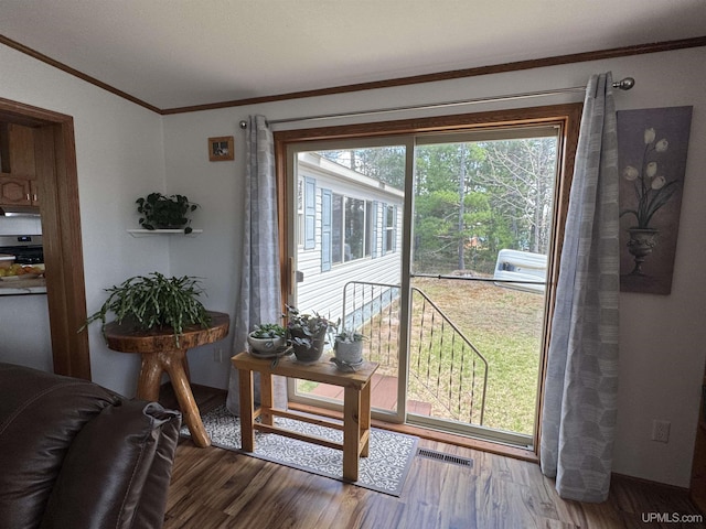 93 E Johnson Lake Rd, Gwinn, MI 49841 - doorway to outside with ornamental molding and wood finished floors
