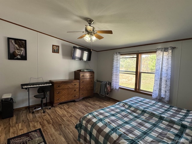 93 E Johnson Lake Rd, Gwinn, MI 49841 - bedroom featuring ornamental molding, wood finished floors, a ceiling fan, and baseboards