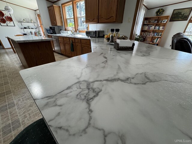 93 E Johnson Lake Rd, Gwinn, MI 49841 - kitchen featuring dishwasher, plenty of natural light, a center island, light countertops, and crown molding