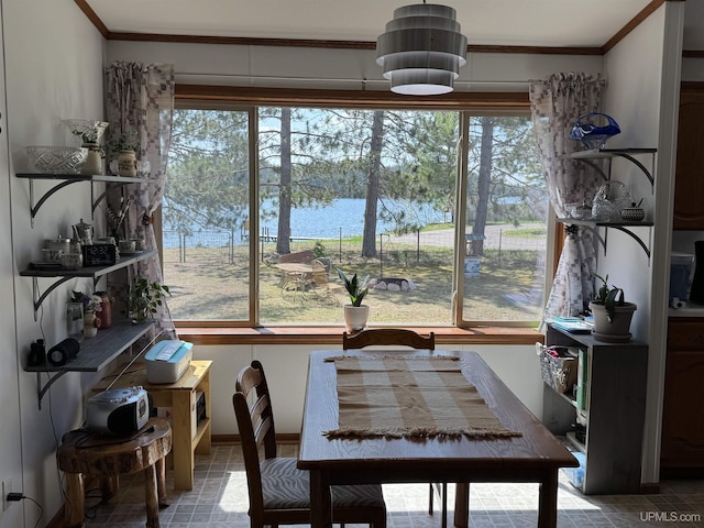 93 E Johnson Lake Rd, Gwinn, MI 49841 - dining room with plenty of natural light, crown molding, and a water view