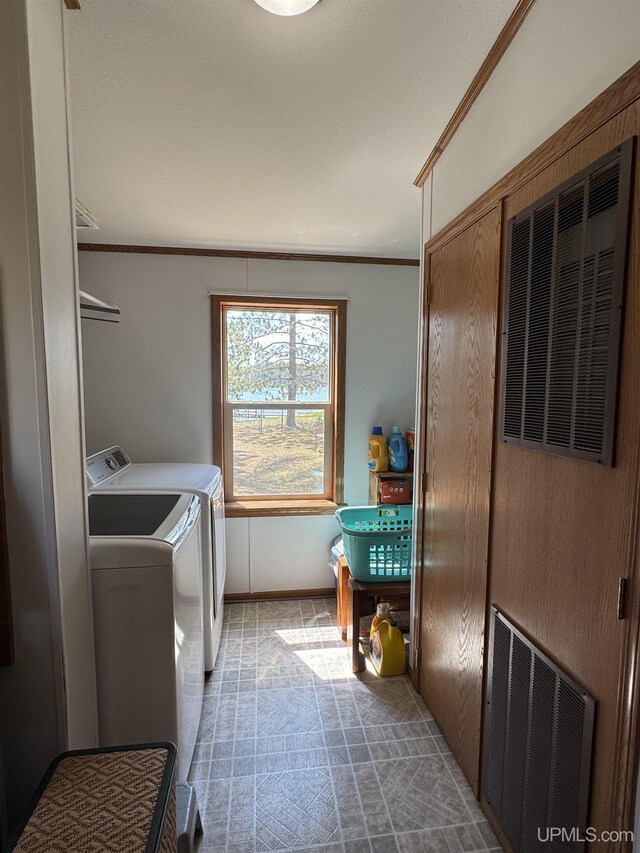 93 E Johnson Lake Rd, Gwinn, MI 49841 - laundry room with independent washer and dryer, ornamental molding, and baseboards