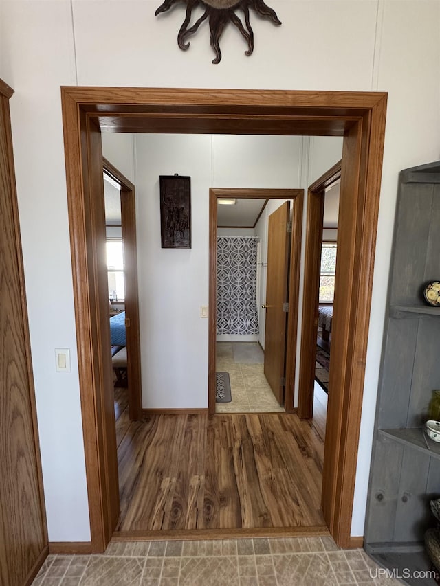 93 E Johnson Lake Rd, Gwinn, MI 49841 - hall with baseboards, plenty of natural light, and wood finished floors