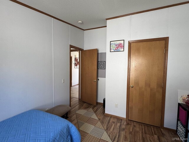 93 E Johnson Lake Rd, Gwinn, MI 49841 - bedroom with wood finished floors and ornamental molding