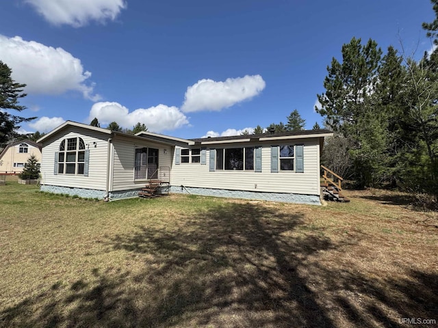 93 E Johnson Lake Rd, Gwinn, MI 49841 - back of property featuring a yard