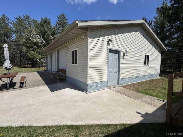 93 E Johnson Lake Rd, Gwinn, MI 49841 - view of side of property featuring a patio area
