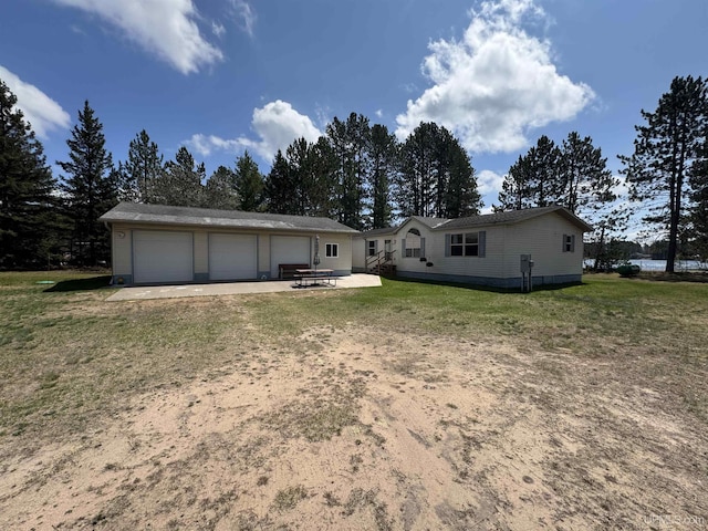 93 E Johnson Lake Rd, Gwinn, MI 49841 - rear view of property with a lawn and a patio