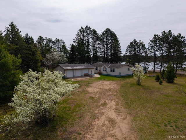 93 E Johnson Lake Rd, Gwinn, MI 49841 - view of front of house featuring driveway and a front lawn