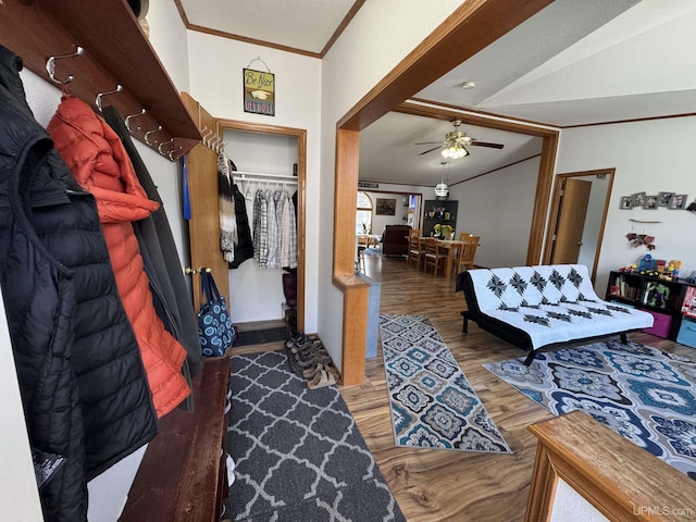 93 E Johnson Lake Rd, Gwinn, MI 49841 - foyer featuring ceiling fan, wood finished floors, and ornamental molding
