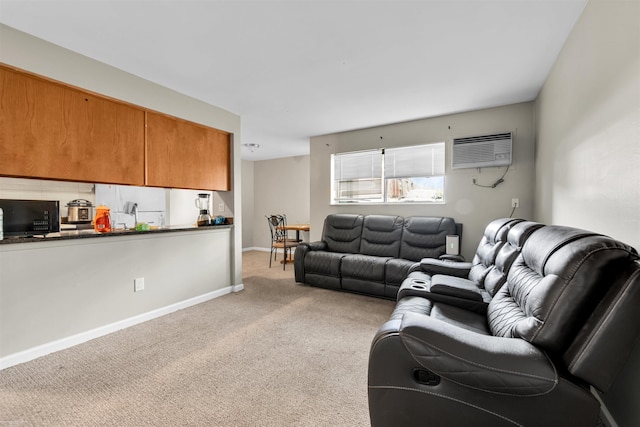 21640 Hillside Dr # 3C, Clinton, MI 48035 - living room featuring an AC wall unit, light carpet, and baseboards
