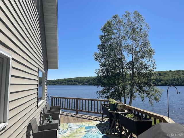 52170 Canal Rd, Houghton, MI 49931 - wooden terrace with a water view and a forest view