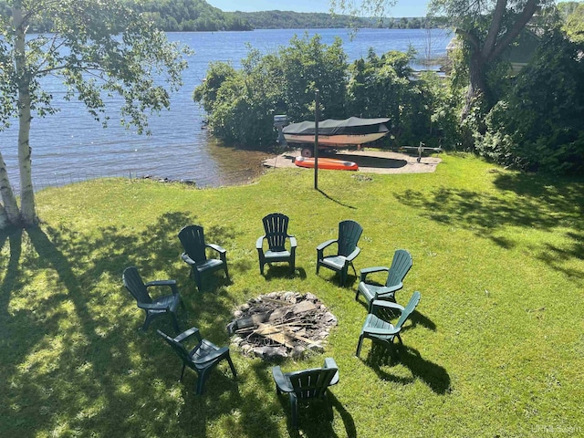 52170 Canal Rd, Houghton, MI 49931 - view of green lawn with a water view and a fire pit