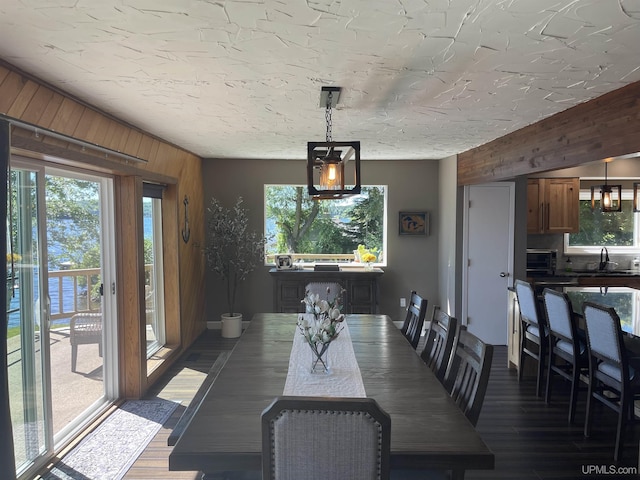52170 Canal Rd, Houghton, MI 49931 - dining room with wood walls and dark wood-type flooring