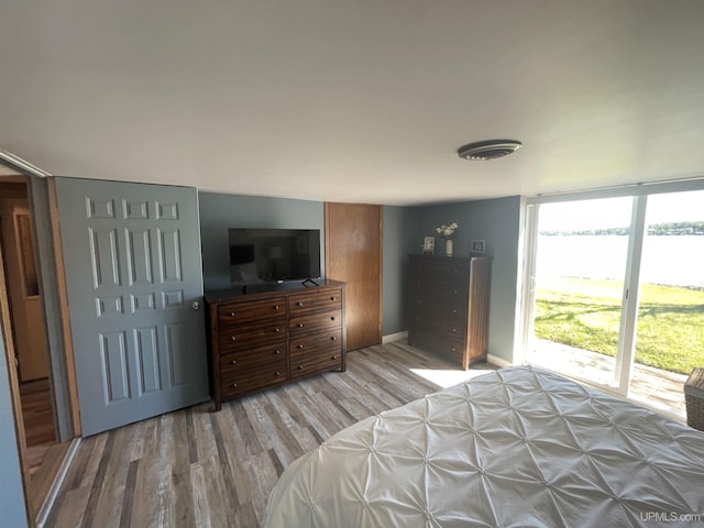 52170 Canal Rd, Houghton, MI 49931 - bedroom featuring light wood-type flooring and baseboards