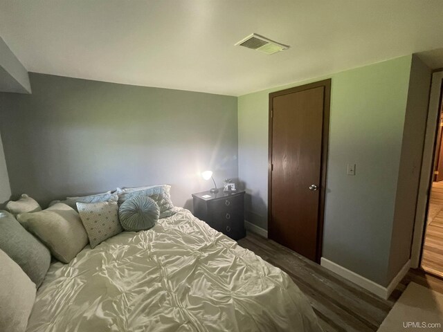 52170 Canal Rd, Houghton, MI 49931 - bedroom featuring wood finished floors and baseboards