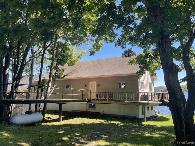 52170 Canal Rd, Houghton, MI 49931 - back of property with a wooden deck, a yard, and a shingled roof