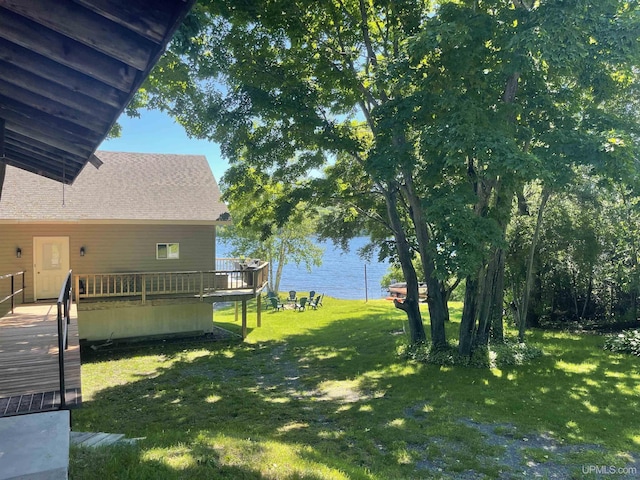 52170 Canal Rd, Houghton, MI 49931 - view of green lawn with a deck with water view