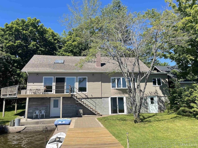 52170 Canal Rd, Houghton, MI 49931 - back of property with stairway, a lawn, and a deck