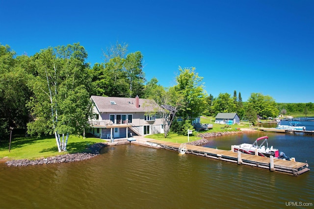 52170 Canal Rd, Houghton, MI 49931 - back of property with a water view and a lawn