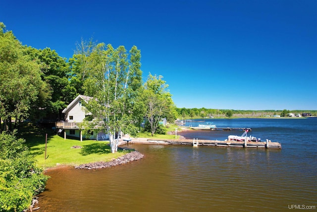 52170 Canal Rd, Houghton, MI 49931 - dock area featuring a water view and a lawn
