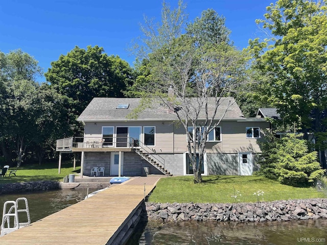 52170 Canal Rd, Houghton, MI 49931 - dock area featuring a yard, stairs, and a deck with water view