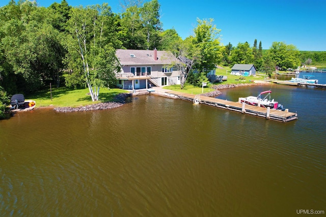 52170 Canal Rd, Houghton, MI 49931 - dock area featuring a water view and a yard