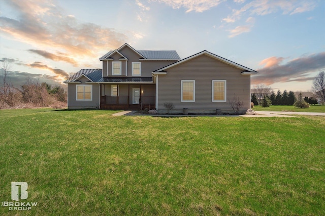 3275 Morrish Rd, Swartz Creek, MI 48473 - traditional-style home with covered porch, a yard, and metal roof