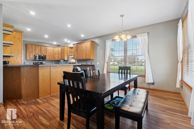 3275 Morrish Rd, Swartz Creek, MI 48473 - dining area featuring a chandelier, wood finished floors, healthy amount of natural light, recessed lighting, and baseboards