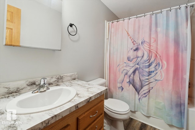 3275 Morrish Rd, Swartz Creek, MI 48473 - bathroom with toilet, vanity, wood finished floors, and shower / tub combo