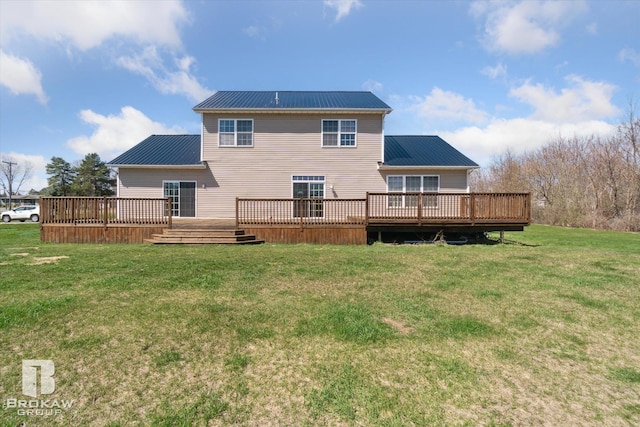 3275 Morrish Rd, Swartz Creek, MI 48473 - back of house with metal roof, a wooden deck, and a lawn