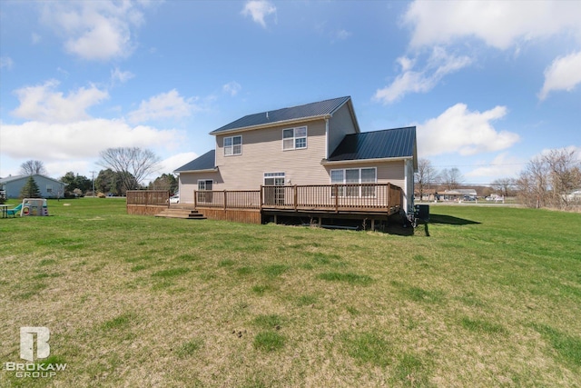 3275 Morrish Rd, Swartz Creek, MI 48473 - back of property featuring metal roof, a deck, and a lawn
