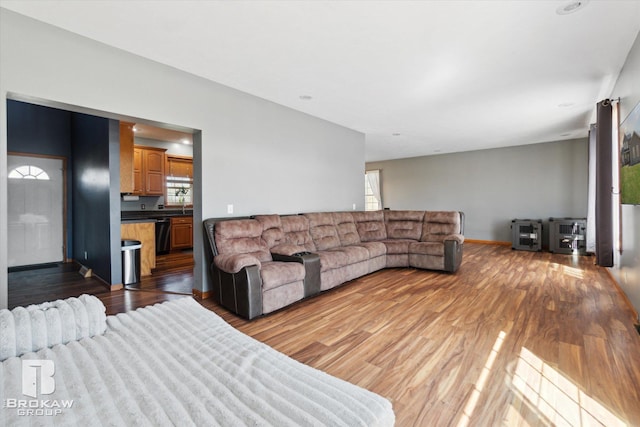 3275 Morrish Rd, Swartz Creek, MI 48473 - living room featuring healthy amount of natural light, light wood-style floors, and baseboards