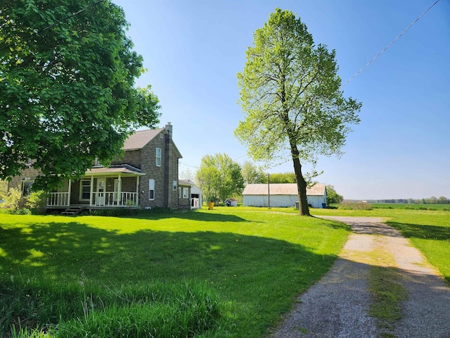 4680 E Kent Rd, Freeland, MI 48623 - view of green lawn with a porch and driveway