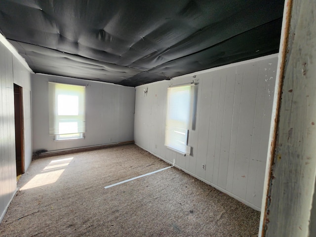4680 E Kent Rd, Freeland, MI 48623 - empty room featuring light carpet and wooden walls