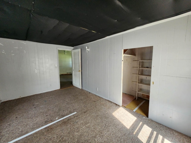 4680 E Kent Rd, Freeland, MI 48623 - unfurnished bedroom with carpet floors and wooden walls