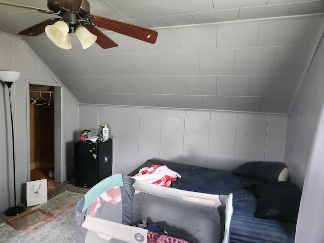 4680 E Kent Rd, Freeland, MI 48623 - bedroom with lofted ceiling, a decorative wall, and a ceiling fan