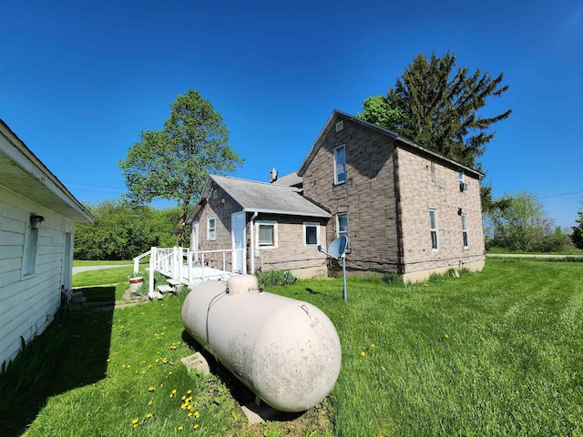 4680 E Kent Rd, Freeland, MI 48623 - view of side of property with a yard and brick siding