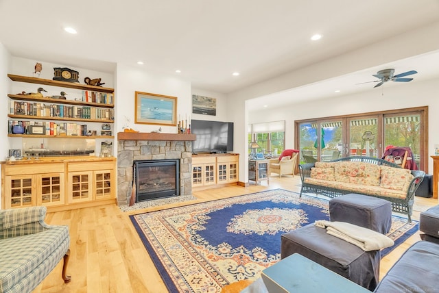 3905 Lakeshore Rd, Lexington, MI 48450 - living room featuring wood finished floors, recessed lighting, ceiling fan, and a fireplace