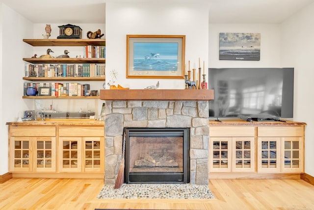 3905 Lakeshore Rd, Lexington, MI 48450 - living area with wood finished floors, wet bar, and baseboards