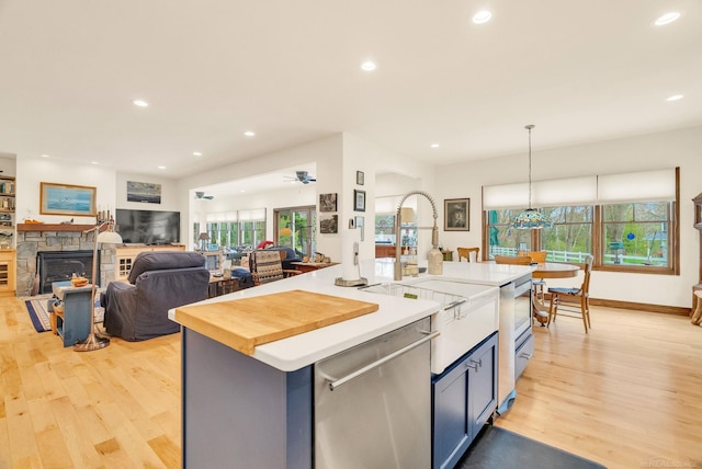 3905 Lakeshore Rd, Lexington, MI 48450 - kitchen with dishwasher, light wood-type flooring, healthy amount of natural light, recessed lighting, and an island with sink