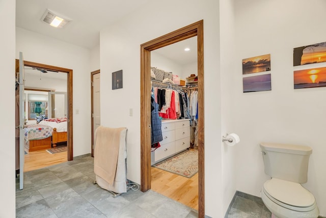 3905 Lakeshore Rd, Lexington, MI 48450 - ensuite bathroom featuring toilet, baseboards, and a spacious closet