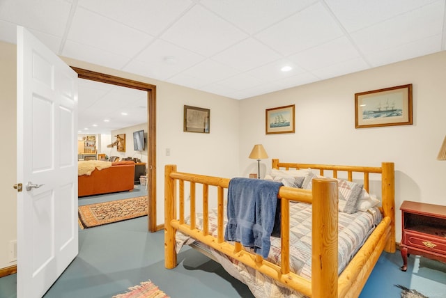 3905 Lakeshore Rd, Lexington, MI 48450 - bedroom featuring a paneled ceiling, recessed lighting, baseboards, and concrete flooring