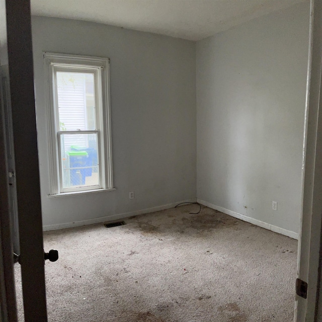 1106 Marsac St, Bay City, MI 48708 - empty room featuring carpet floors and baseboards