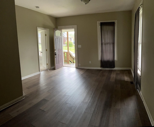 1106 Marsac St, Bay City, MI 48708 - foyer with dark wood-type flooring and baseboards