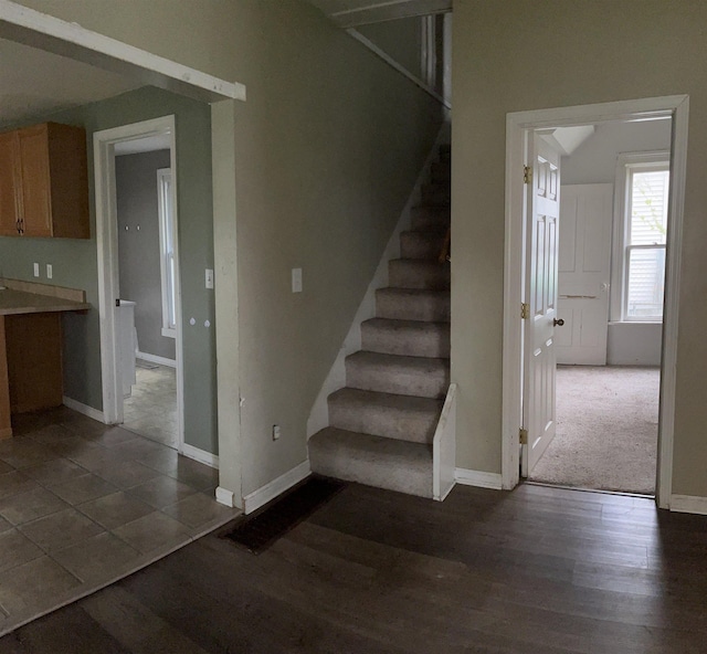1106 Marsac St, Bay City, MI 48708 - stairs featuring baseboards and wood finished floors